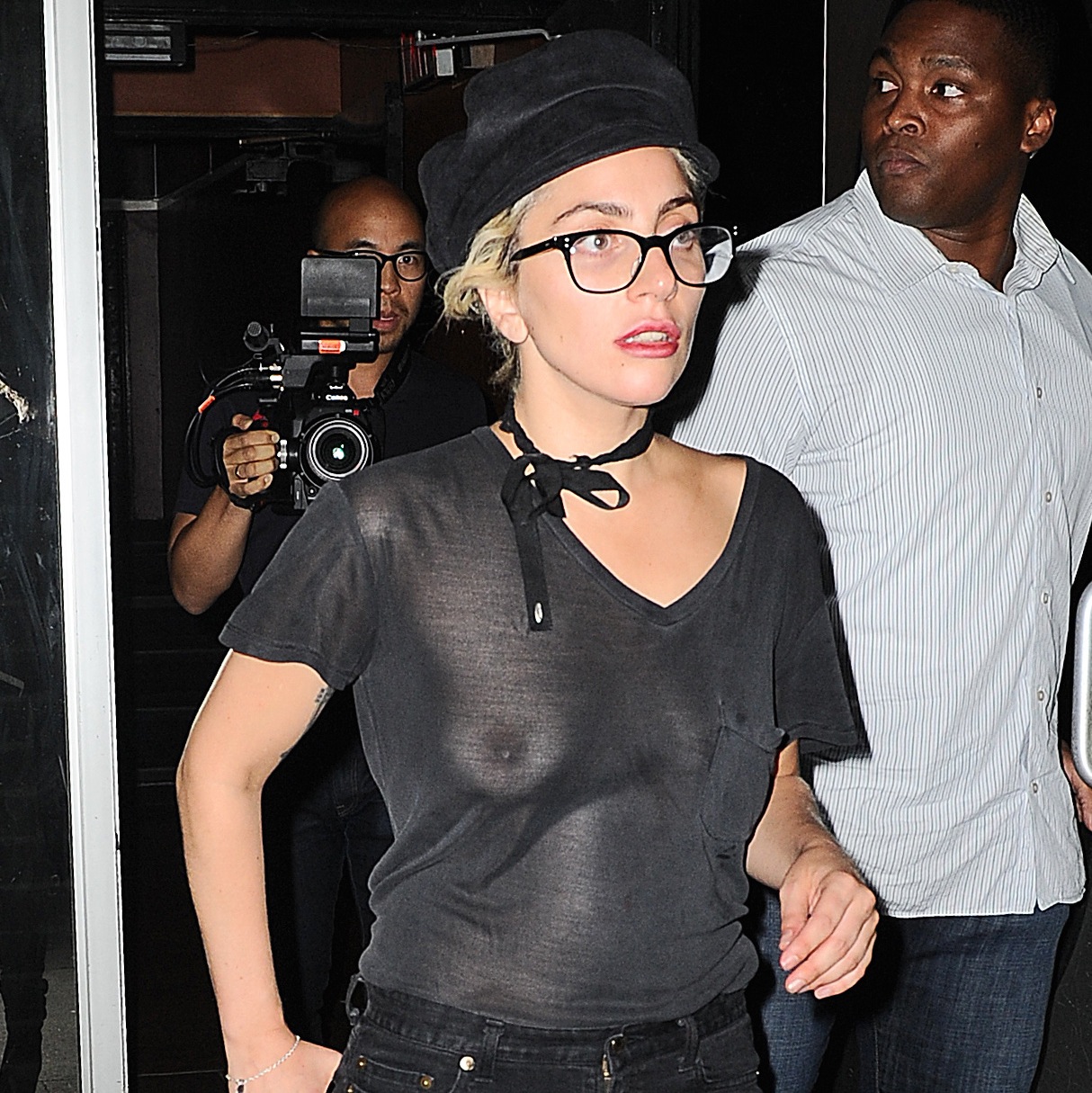 Lady Gaga looks fresh-faced and healthy as she flashes her bra under a net  top