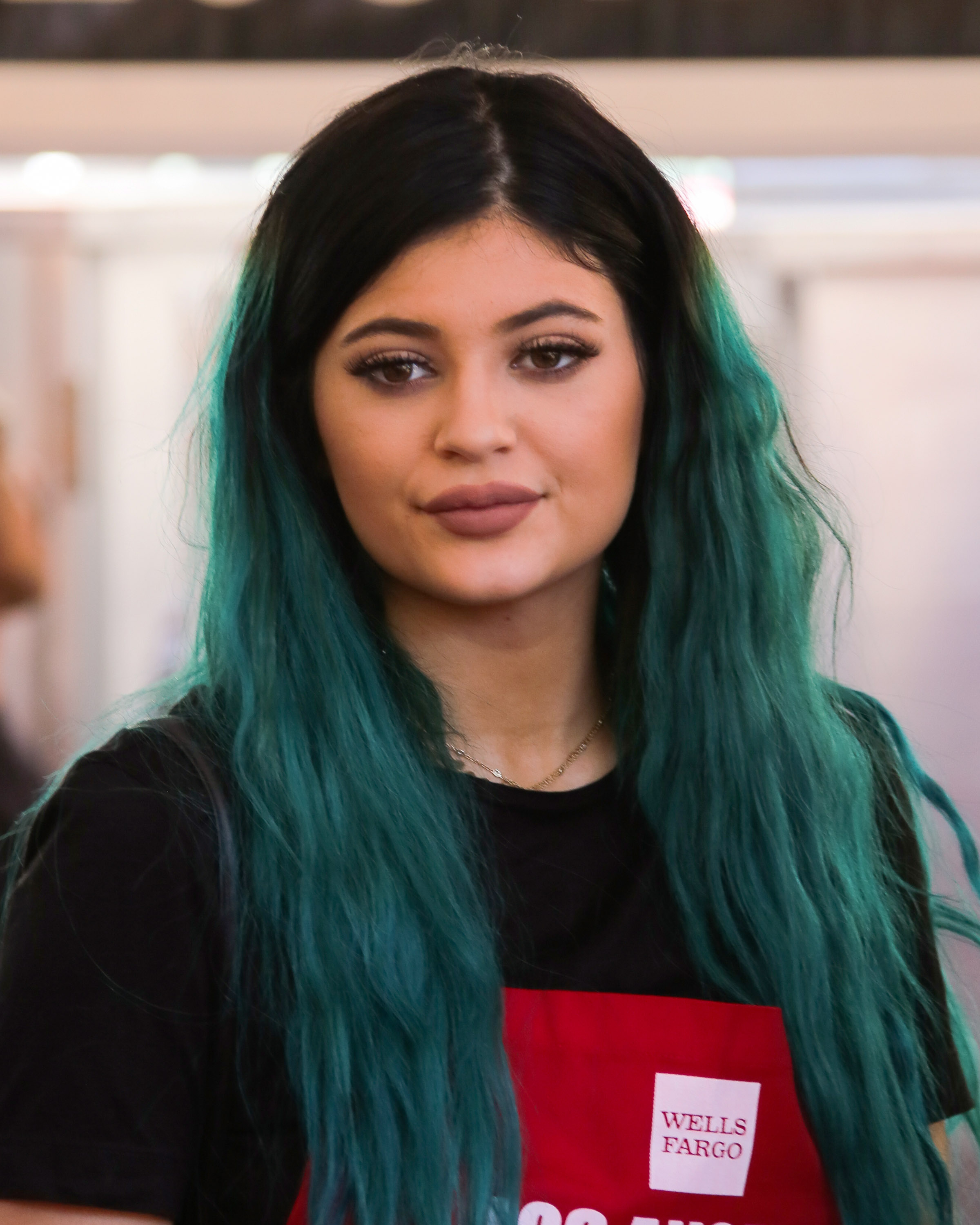 Kylie Jenner looks unrecognizable with new eyebrows as she nearly topples  out of plunging mini dress in new NSFW photo