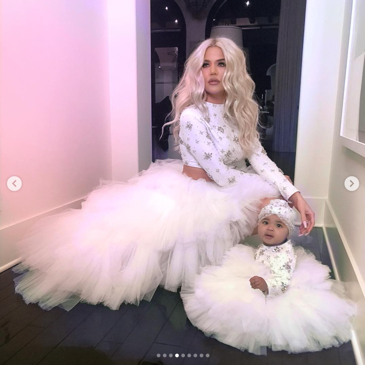True Thompson wears a sparkling princess gown while playfully twirling  around mom Khloe's backyard