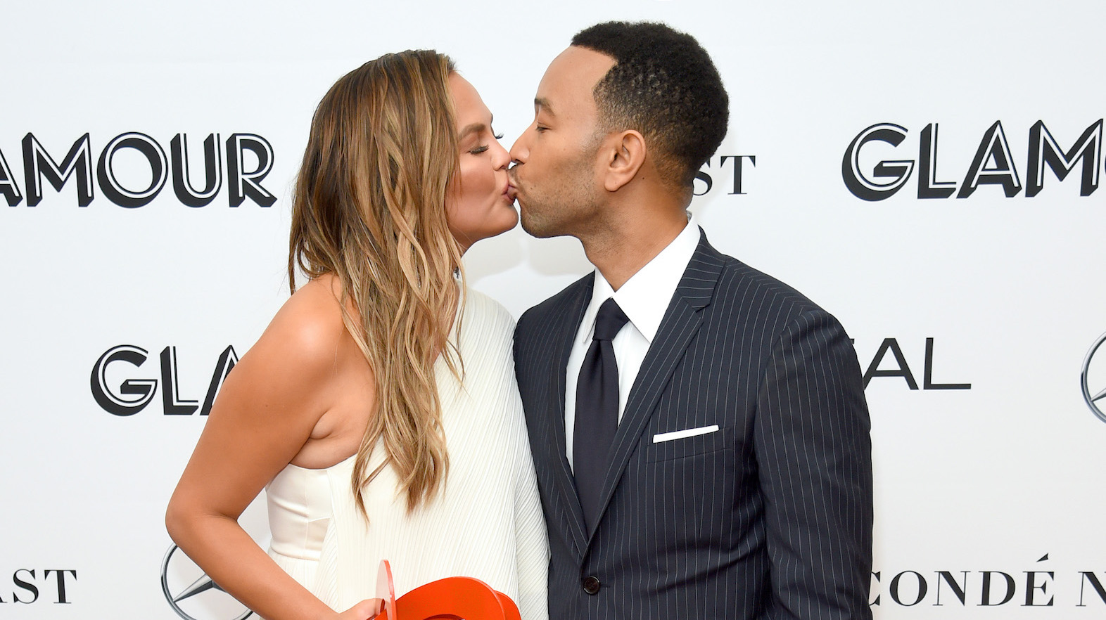 John Legend Wears Pink, Gives Chrissy Teigen a Kiss on Her Bday