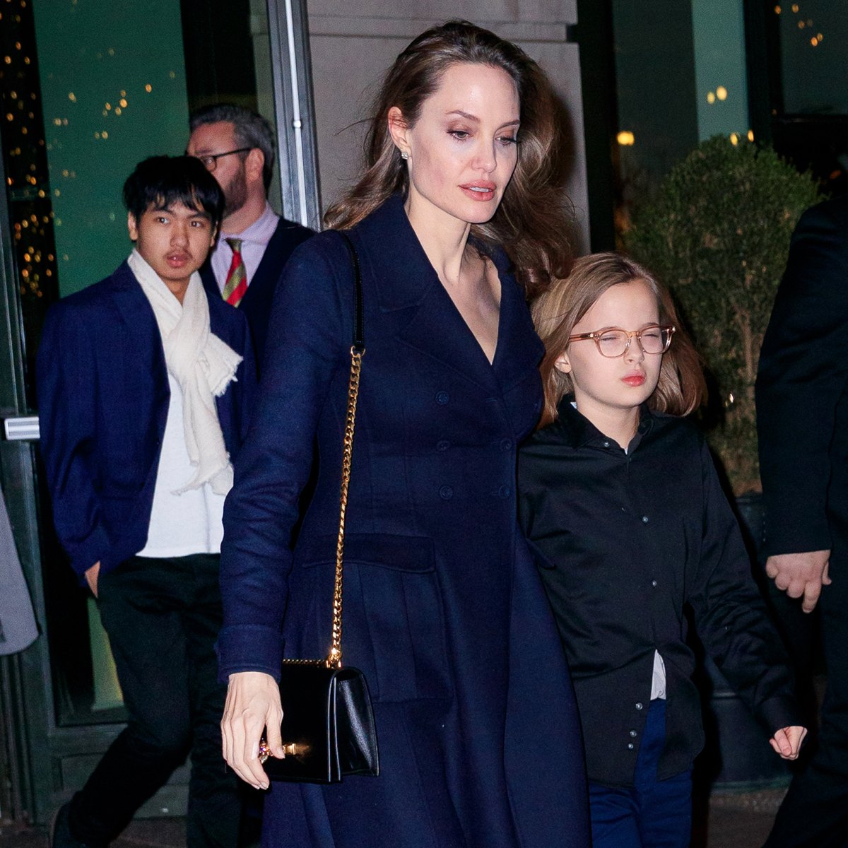 Angelina Jolie looks chic in all black as she arrives to JFK airport in NYC  with kids Pax and Vivienne as the movie star reveals her daughter  'inspired' her to take on