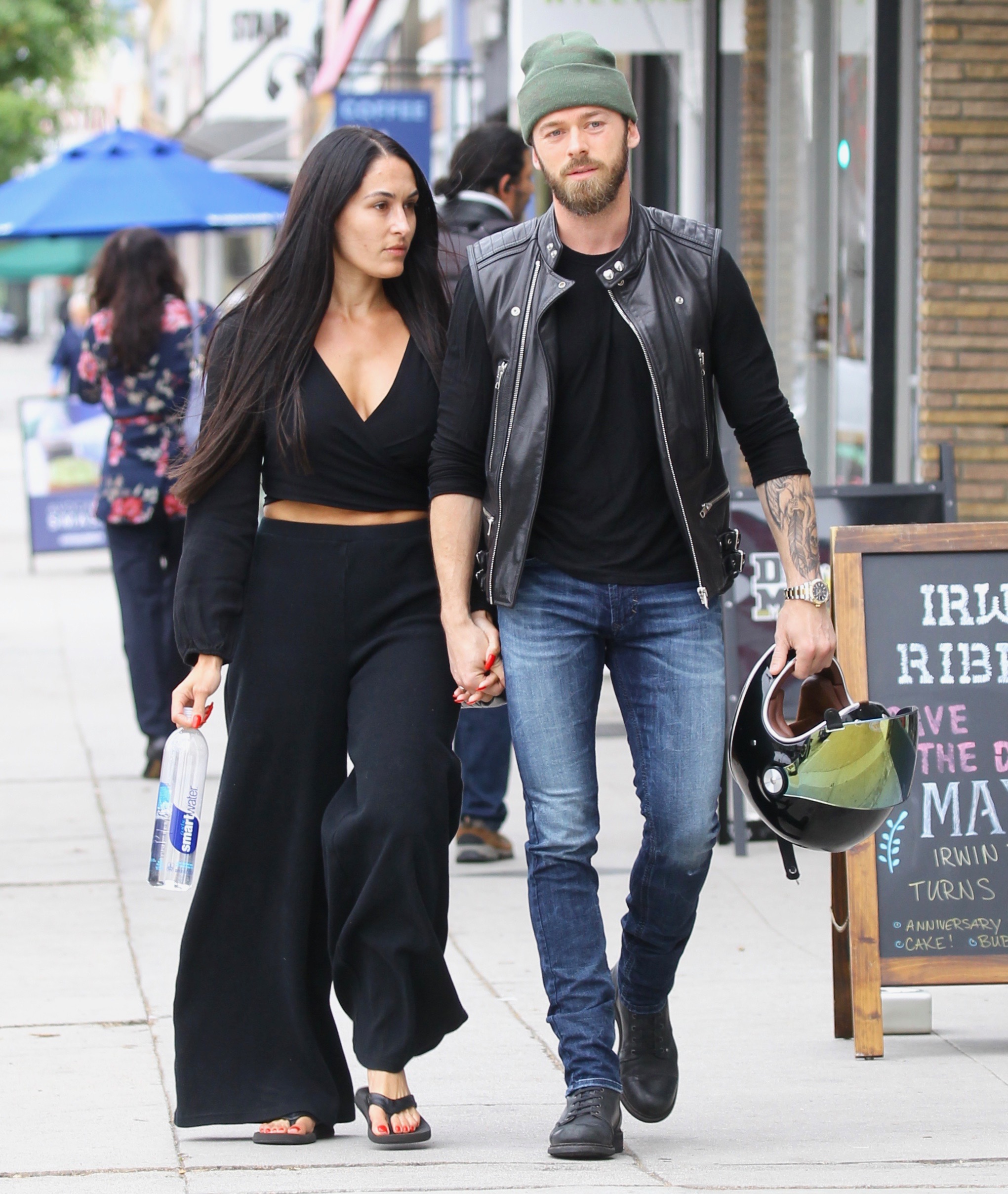 Nikki Bella Flashes Baby Bump While Kissing Artem Chigvintsev