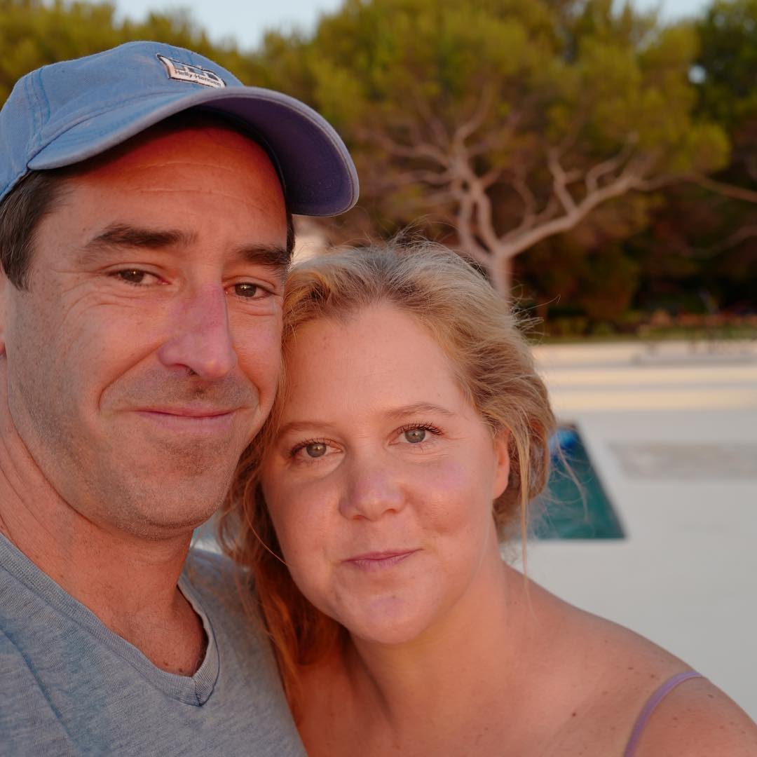 Amy Schumer Gives Husband Chris Fischer A Haircut Watch Video