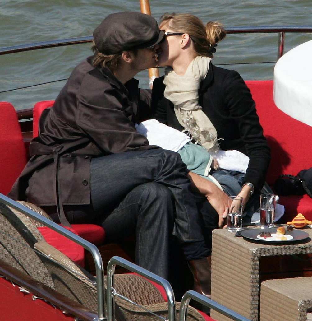 Merry Christmas from Hollywood! Gisele gets a kiss from Tom Brady