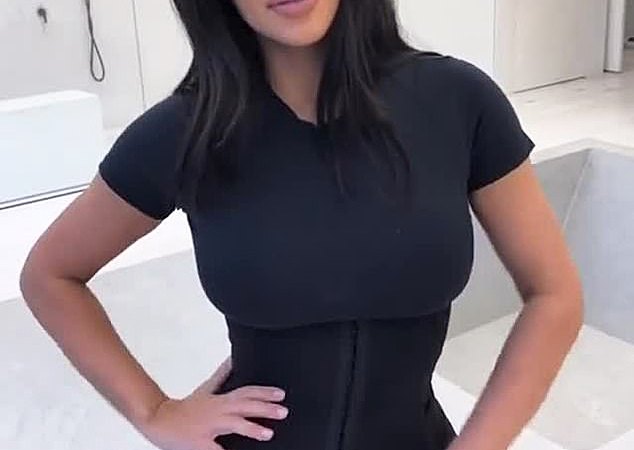 Kim Kardashian shows off her famous curves and tiny waist in