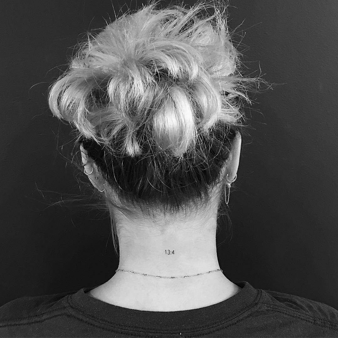 Tiny Pisces Back Of The Neck Tattoo