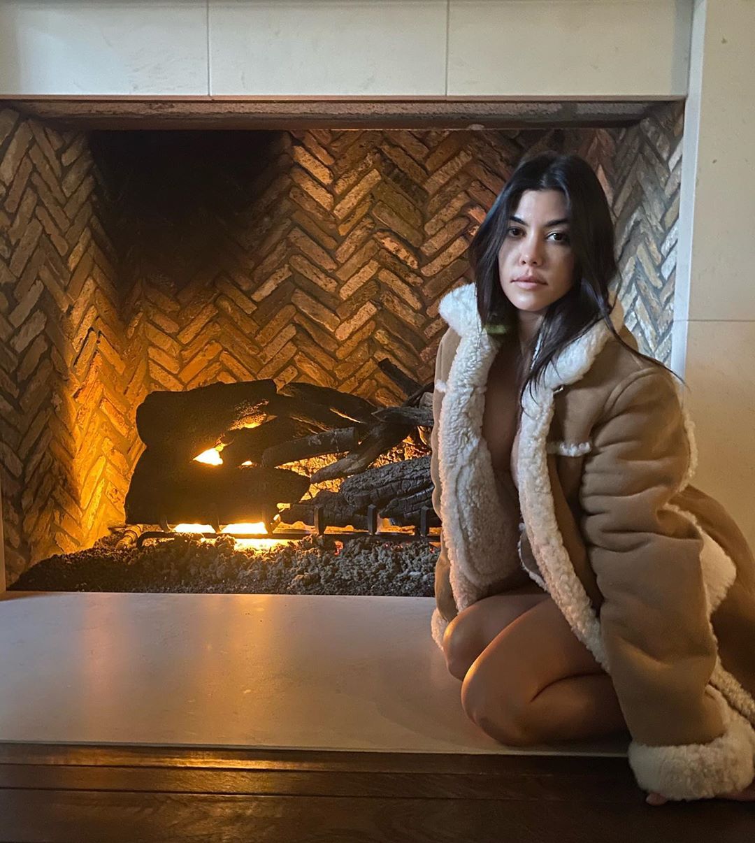 Kourtney Kardashian Shares a Sexy Fireside Photo on Instagram photo
