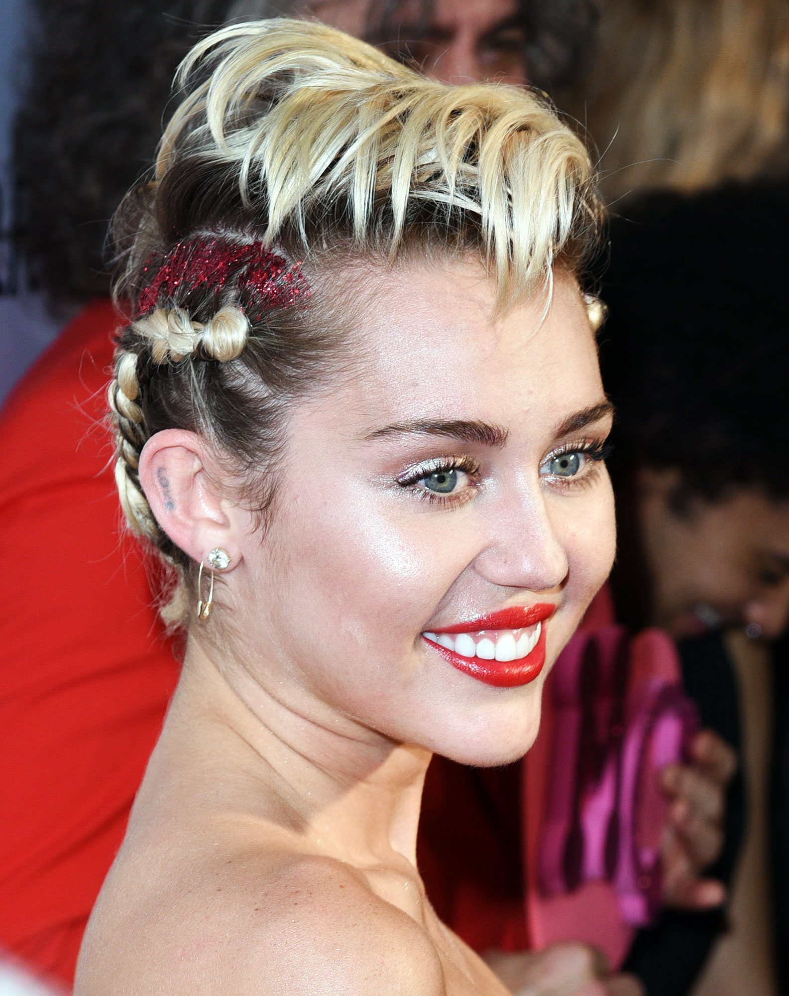 Love Tattoo on Right Ear Miley Cyrus Tattoo Guide