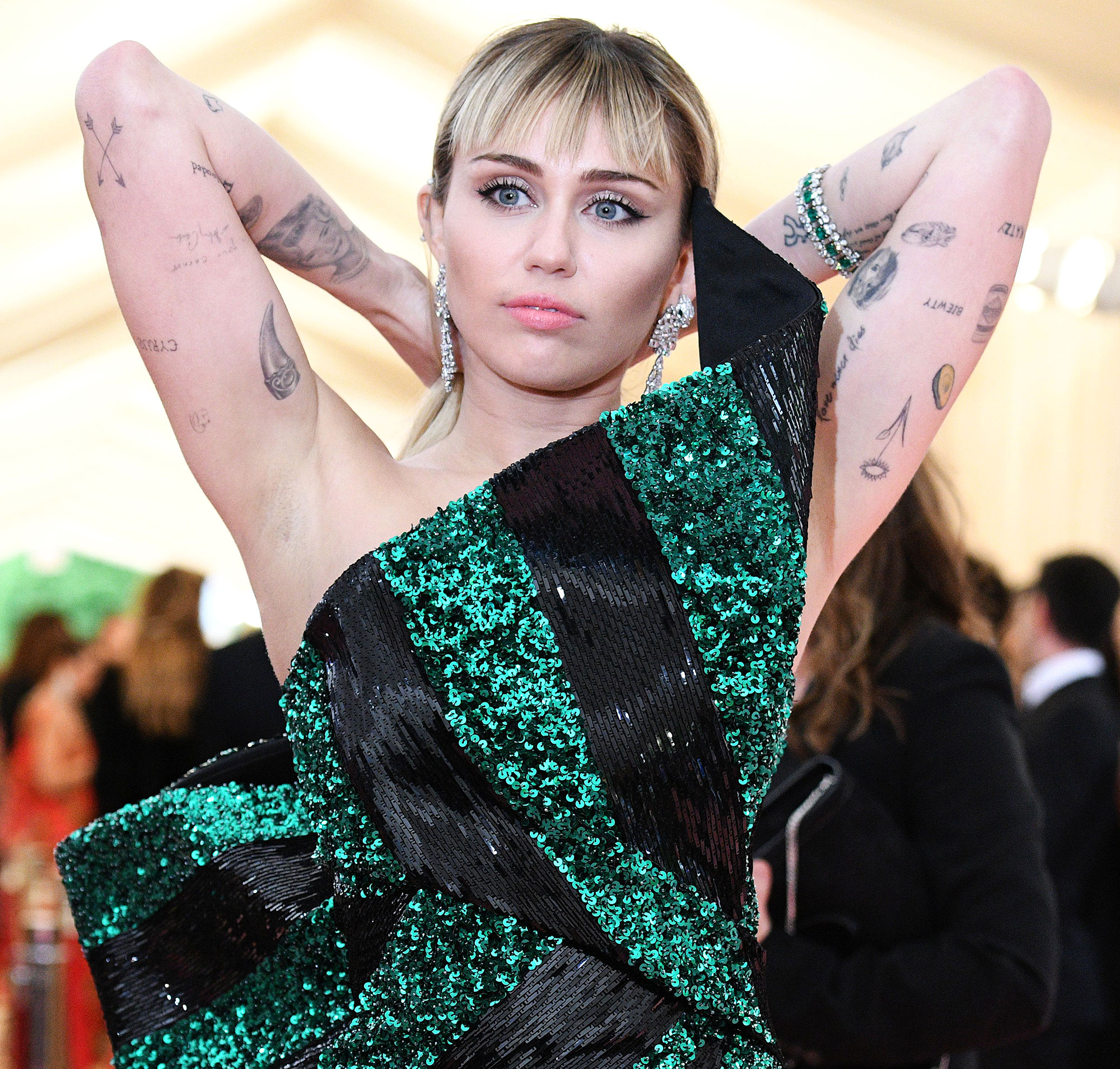 A Look at Miley Cyruss Tattoos And How Removal Would Look  Removery