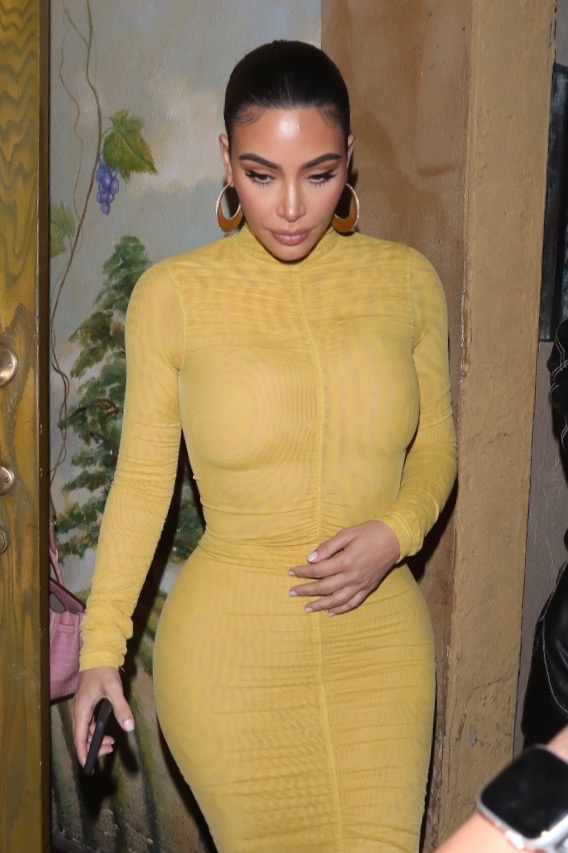 Kim Kardashian's Bodycon Yellow Dress + Strappy Sandals Are Trendy