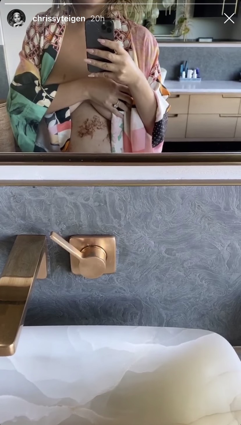 Pregnant Chrissy Teigen Shows Bare Baby Bump in Bathroom Selfie
