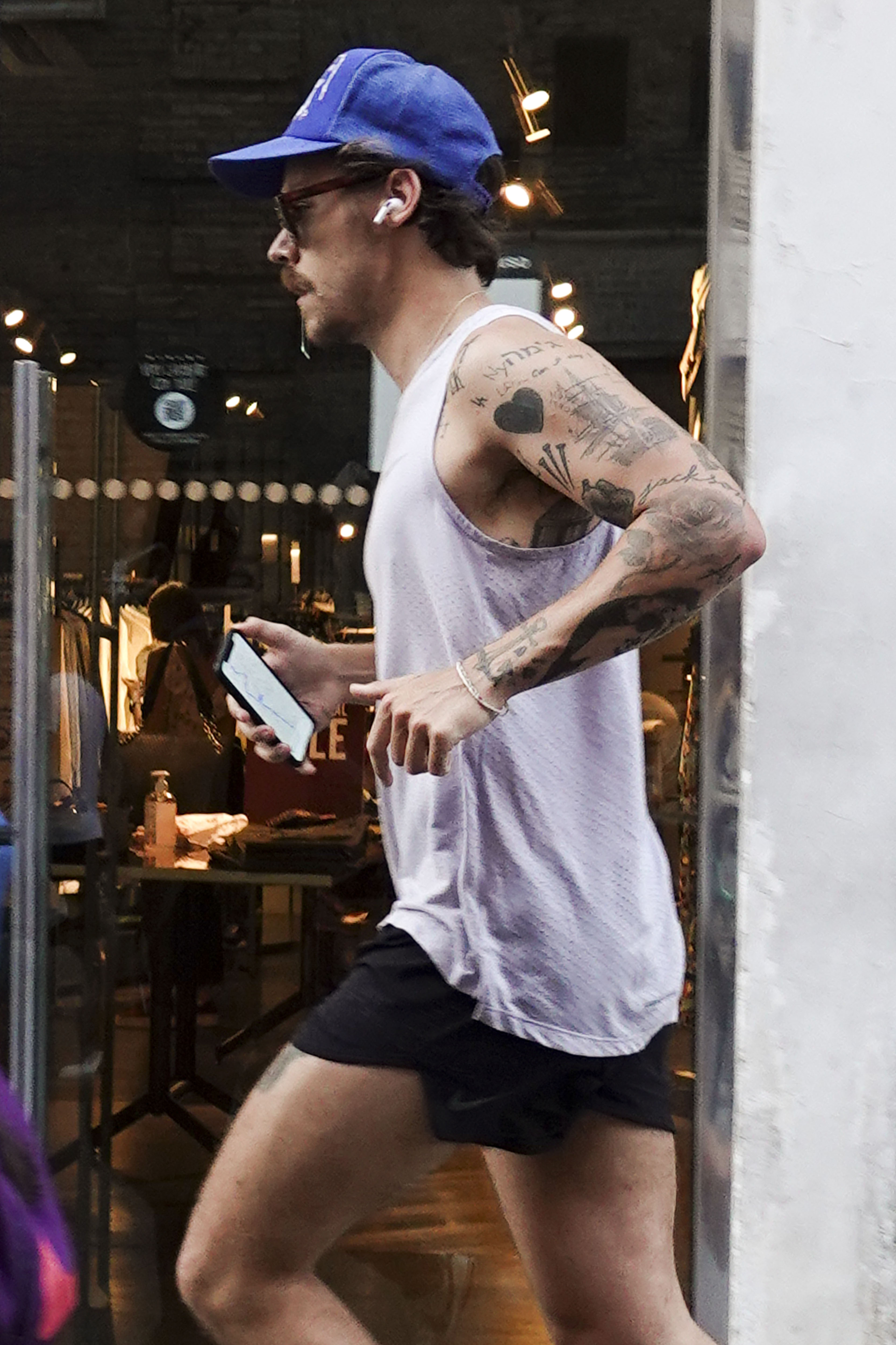 Harry Styles Running in Italy With New Mustache See Photos