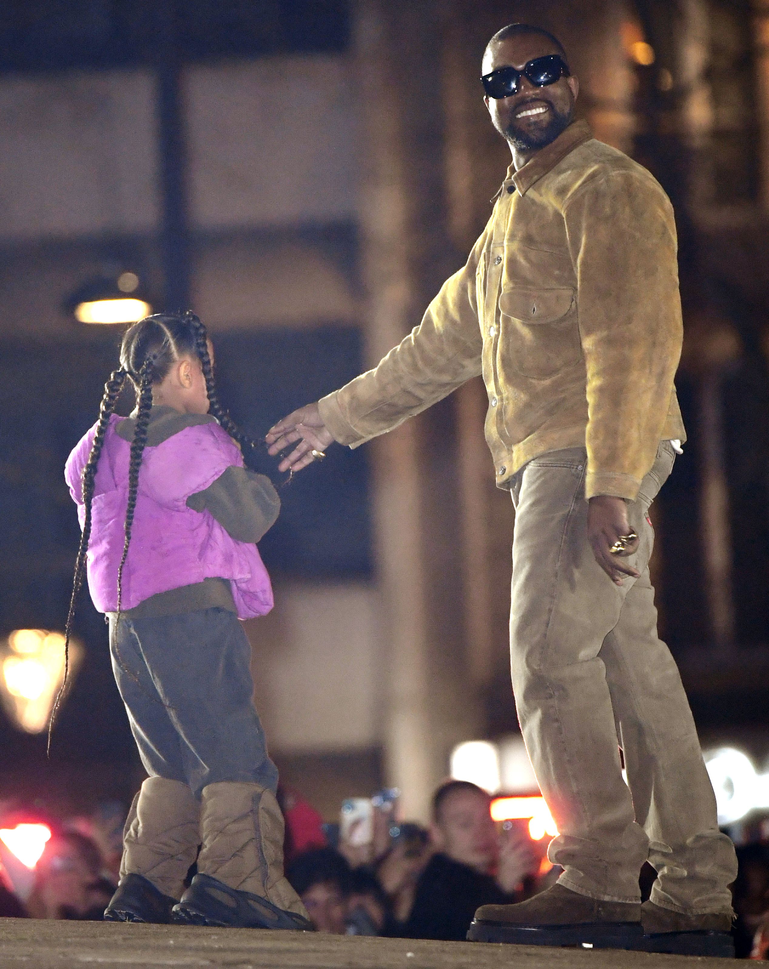 Saint West Goes For Ride On Dad Kanye West's Shoulders — Cute Pics –  Hollywood Life