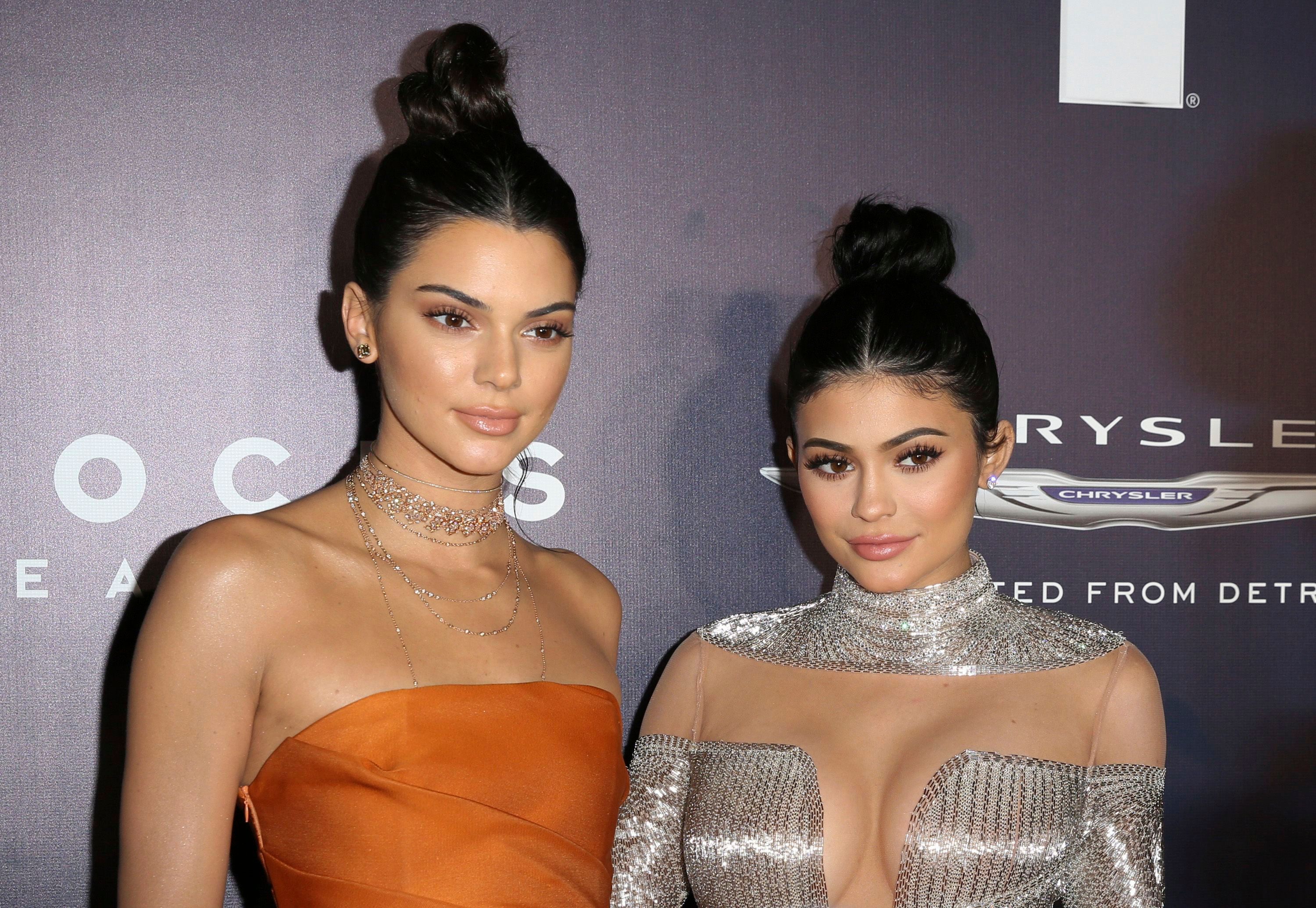 Kendall and Kylie Jenner coordinate in grey as they enjoy mall