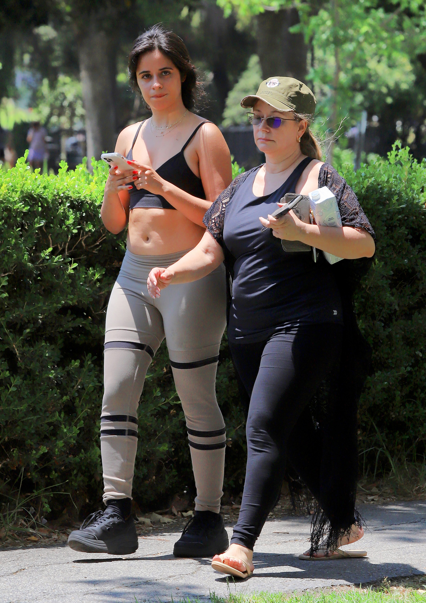 https://www.lifeandstylemag.com/wp-content/uploads/2021/07/Camila-Cabello-Flaunts-Curves-in-Leggings-and-a-Sports-Bra-During-a-Walk-With-Her-Mom-05.jpg?fit=800%2C1132&quality=86&strip=all