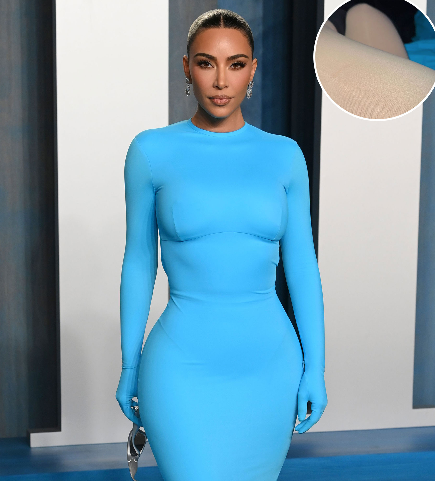 Kim Kardashian shows off her tiny waist and long legs in skintight