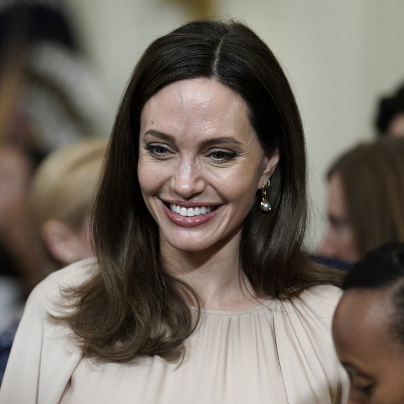 Angelina Jolie shows off new look as she visits her NY store